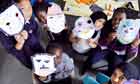 Primary school children with emotion masks