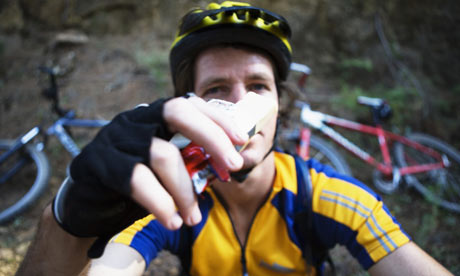 Cyclist eating an energy bar