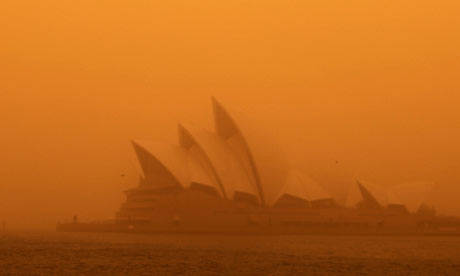 A dust storm blankets Sydney's iconic Opera House at sunrise