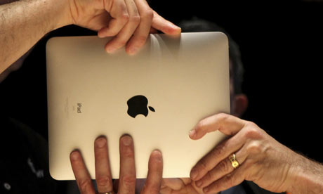 Members of the technology media try out Apple's  