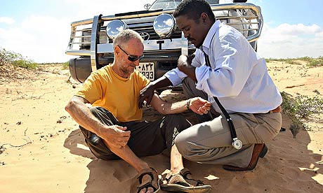 Paul Chandler being examined by Somali doctor Abdi Mohamed Helmi Hangul.