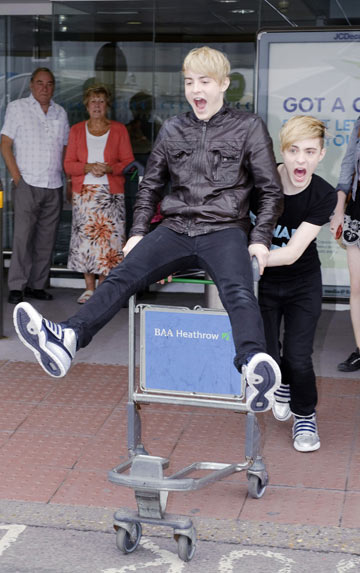 Jedward arrive at Heathrow airport