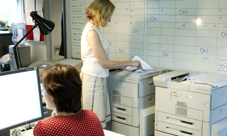 Woman uses office computer printer