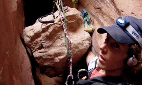 Aron Ralston prepares to chop off his own arm to free himself 48 hours into