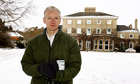 Julian Assange talks to reporters at Ellingham Hall, home of Frontline Club founder Vaughan Smith