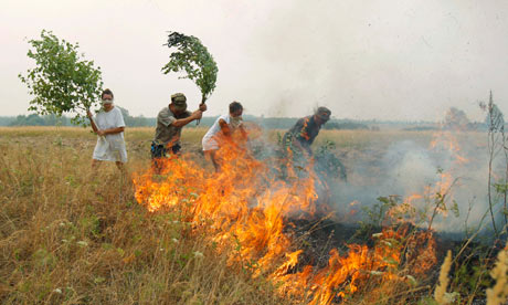Russians attempt to put out a fire during a month-long heatwave, summer 2010