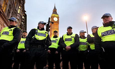 Police officers stand guard outside parliament during the recent student protests.