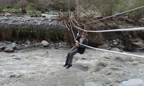 CHRIS STEWART crosses a swollen river near his home. Photograph: Ana ...