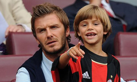 romeo beckham long hair. Romeo Beckham with his father