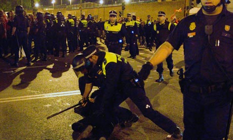 Police detain a protester in Madrid, Spain