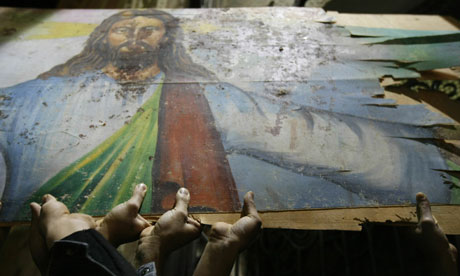 Egyptian Christians hold a blood-stained