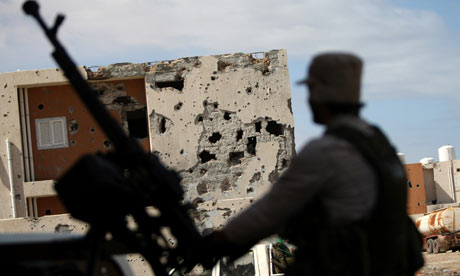 A fighter mans a machine-gun in the streets of Sirte.