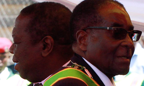 Robert Mugabe, right, who blames the west for toppling Arab autocrats, and Morgan Tsvangirai. 
