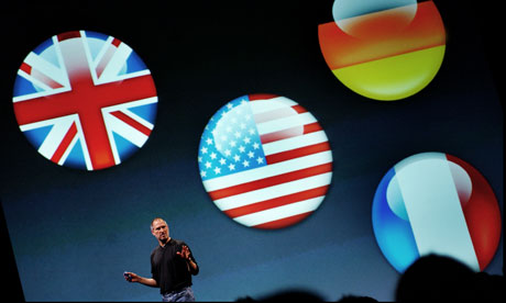 Steve Jobs stalking the stage in black polo-neck and blue jeans