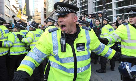 Police at the student protest over university tuition fees in London on 9 November