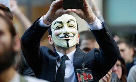 A protester at Occupy Seattle wears a V for Vendetta Guy Fawkes mask. Photograph: Ted S Warren/AP