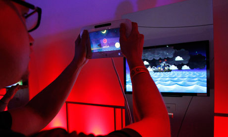 a man plays with Nintendo Wii U controller