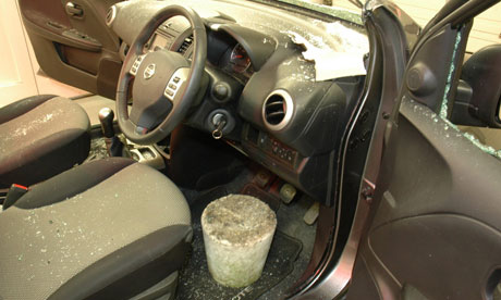 Concrete block in damaged car
