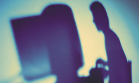 Silhouette of a computer user