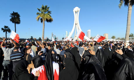 Protesters in Bahrain celebrate after reaching Lulu Square in the capital city of Manama