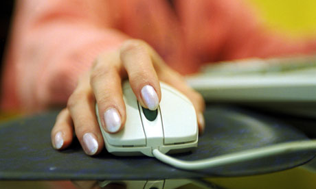A woman using a PC computer mouse.