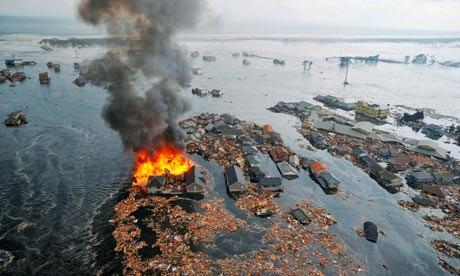 Houses are swept away by the tsunami in Natori, Miyagi Prefecture