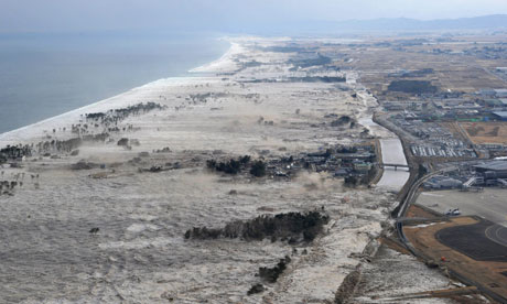 Earthquake-triggered tsumanis sweep along the shore in Iwanuma, northern Japan