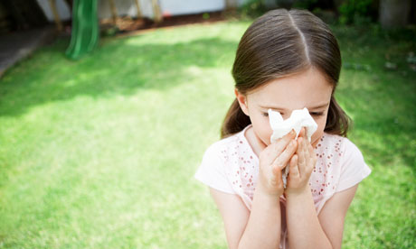 Little Girl Blowing Her Nose