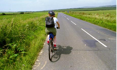 Cycling along an empty road on th Isle of Wight