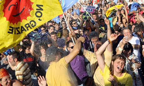 People celebrate following results in Italian referendums on water and nuclear power in Rome