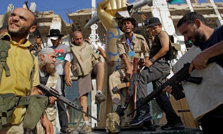 Libya fighters storm Gaddafi compound