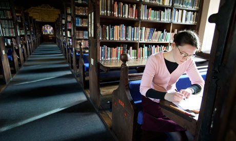 A student studies in her college library