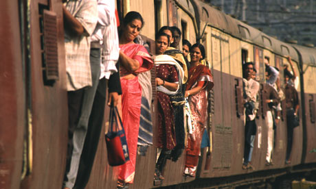 MDG : Morning train commuters on a train bound for Mumbai, India