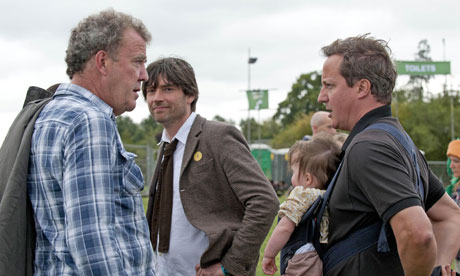 Alex James looks on as Jeremy Clarkson talks to David Cameron