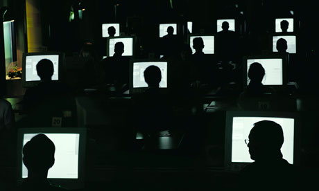 People working at computers in the dark