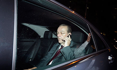 Oswald Grubel leaves the UBS offices in Singapore.