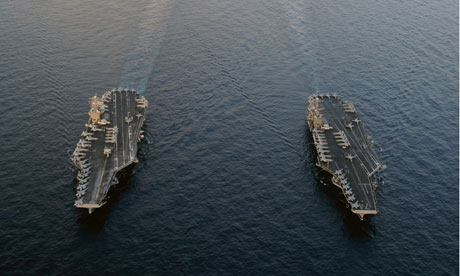 US aircraft carriers patrol near the Strait of Hormuz.