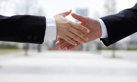 Businessmen shake hands