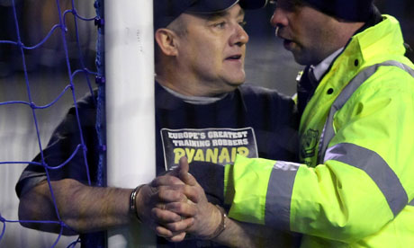 A man handcuffs himself to the goalposts at Everton v Manchester City