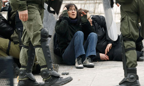 Greece strikes: Demonstrators are detained by riot police