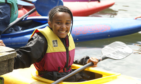 A long way from cake-baking … Kayaking with the Girl Guides.