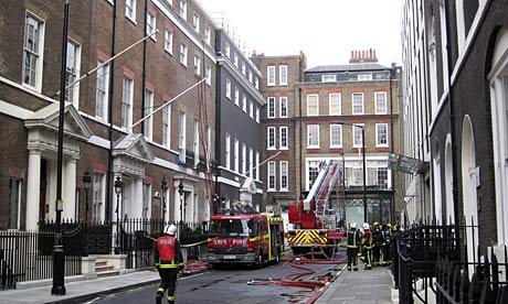 Firefighters attend the fire in Grafton Street, London.