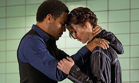 Lenny Kravitz and Jennifer Lawrence in The Hunger Games.