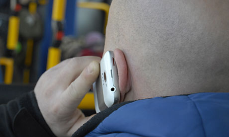 A man talks on an HTC smartphone in Copenhagen