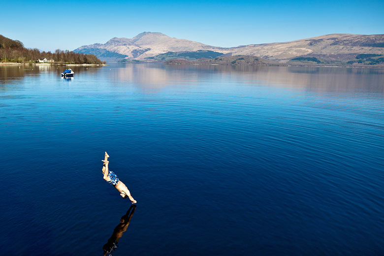 Eyewitness: A swimmer cools off in the spring heat by plunging into Loch Lomond
