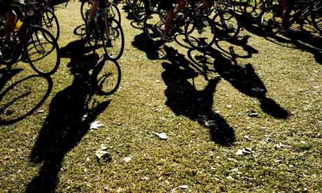 The silhouettes of cyclists on Clapham Common, cyclists taking part in the London-Brighton Bike Ride