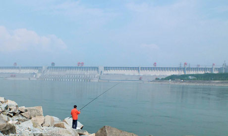 A man fishes in a reservoir near the Three Gorges Dam in Yichang, Hubei province, China