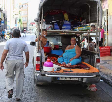 A family living in a pickup truck in Athens, June 2012