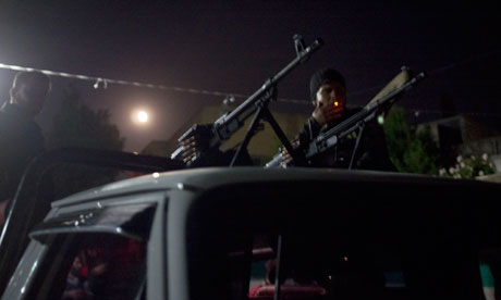 Free Syrian Army members prepare for an early morning attack on Idlib city