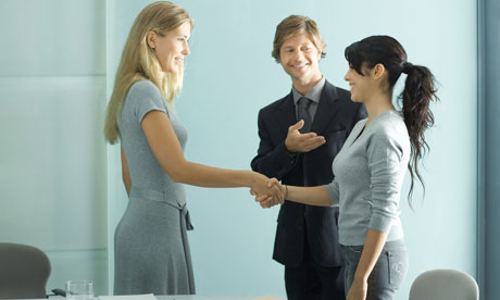 Teenage girl is introduced to businesswoman